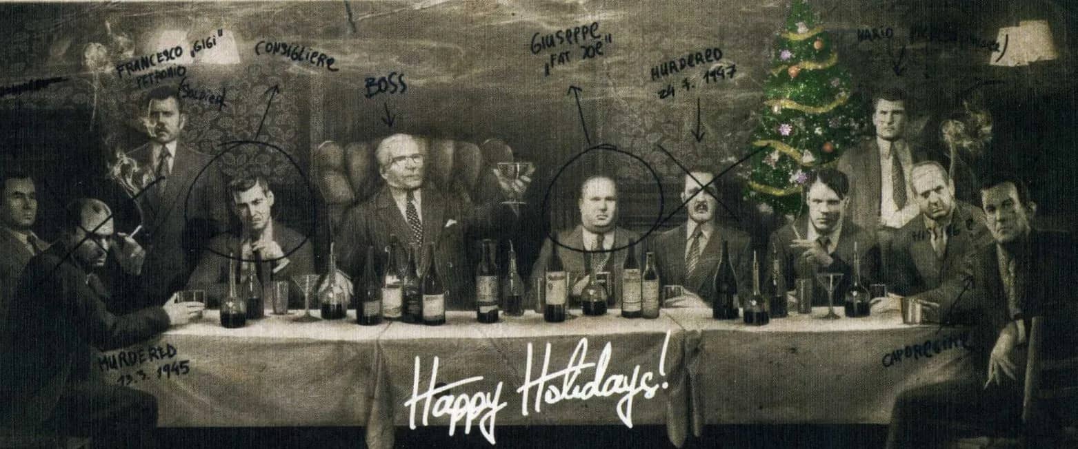 Men in suits gathered around a dinner table